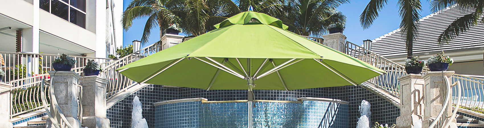 Green Frankford Greenwich Market Umbrella in a luxurious hospitality setting